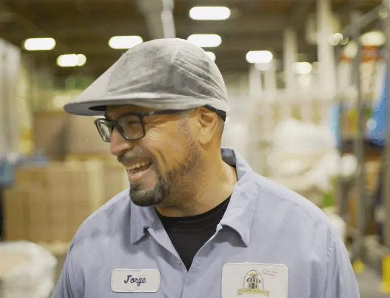 A happy employee smiling while at work